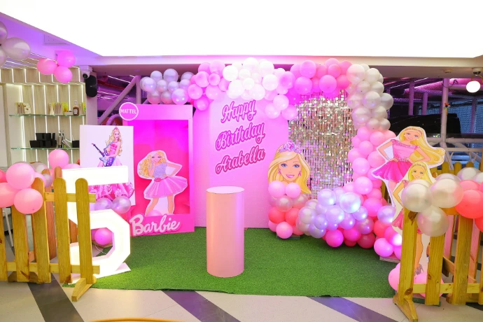 Barbie themed birthday party decoration with balloons